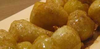 Χρυσαφένιοι Ποντιακοί Λουκουμάδες (τσιριχτά) μέσα σε πιατέλα, πασπαλισμένοι με κρυσταλλική ζάχαρη και περιχυμένοι με μέλι