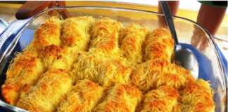 Τραγανή τυρόπιτα κανταΐφι, κομμένη σε μερίδες, σερβιρισμένη ζεστή.