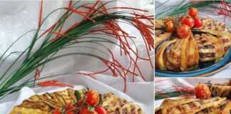 Τιμπάλ μελιτζάνας αναποδογυρισμένο σε πιατέλα, γαρνιρισμένο με ντοματίνια.