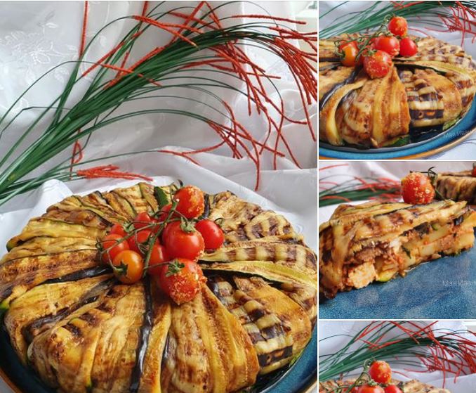 timpel Τιμπάλ μελιτζάνας αναποδογυρισμένο σε πιατέλα, γαρνιρισμένο με ντοματίνια.