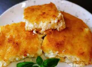 Χρυσαφένια τυρόπιτα σουφλέ με φύλλο καταϊφι, φρεσκοψημένη σε ταψί.