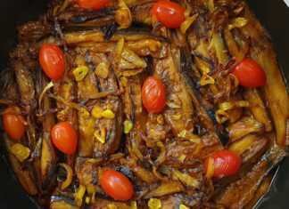 Ένα ταψί με λαχταριστές Μελιτζάνες με κρέας στο φούρνο, έτοιμο για σερβίρισμα