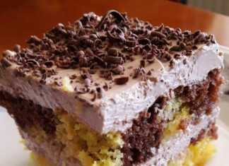 Διχρωμο κεικ με κρέμα Κομμάτι από δίχρωμο κέικ με ορατές τις στρώσεις παντεσπανιού και κρέμας.