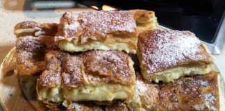 Χρυσαφένια Μπουγάτσα με Κρέμα, πασπαλισμένη με άχνη και κανέλα.