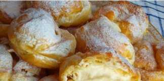 Πιάτο με αφράτα σουδάκια γεμισμένα με κρέμα, πασπαλισμένα με άχνη ζάχαρη ή περιχυμένα με σοκολάτα.