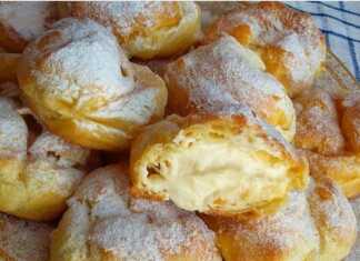 Αφράτα σουδάκια γεμισμένα με κρέμα και πασπαλισμένα με ζάχαρη άχνη.