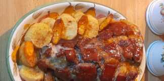 Το τελικό **Κότσι Χοιρινό στο Φούρνο** με τραγανή πέτσα και ροδοκοκκινισμένες πατάτες.