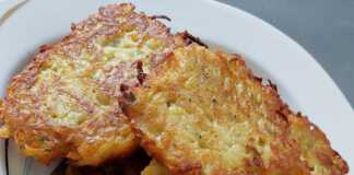 Χρυσαφένιες τηγανίτες πατάτας σε ένα πιάτο, έτοιμες για σερβίρισμα.