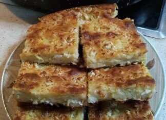 Χρυσαφένια μπατζίνα στο ταψί με ξεροψημένη φέτα στην επιφάνεια και κομμάτια φρέσκου κολοκυθιού