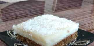 Κυπριακή καρυδόπιτα με αφράτη βάση, αρωματικό σιρόπι και βελούδινη κρέμα καρύδας. Μια παραδοσιακή συνταγή για ένα απολαυστικό γλυκό.