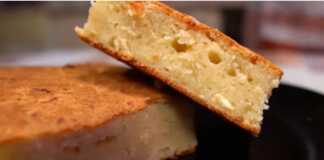 Αφράτη πίτα με γιαούρτι και φέτα, κομμένη σε κομμάτια, με χρυσαφένια κρούστα.