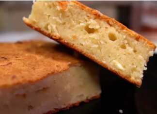 Αφράτη πίτα με γιαούρτι και φέτα, κομμένη σε κομμάτια, με χρυσαφένια κρούστα.