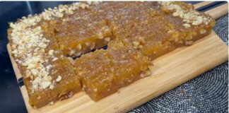 Σπιτικός χαλβάς με ξηρούς καρπούς σερβιρισμένος σε πιάτο.