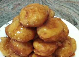 Αφράτοι **Λουκουμάδες με Μέλι** πασπαλισμένοι με κανέλα και καρύδι.