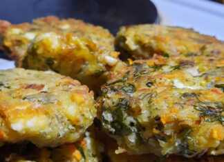 Χρυσαφένια τηγανητά κεφτεδάκια λαχανικών σε πιατέλα με απορροφητικό χαρτί και φρέσκο άνηθο