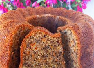 Αρωματικό Κέικ Καρότου με Καρύδια Ένα κομμάτι κέικ καρότου με καρύδια, πασπαλισμένο προαιρετικά με ζάχαρη