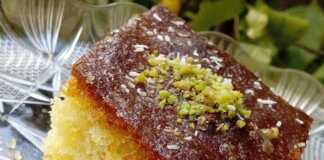 Αφράτο και Αρωματικό Ραβανί Σπιτικό ραβανί σιροπιασμένο, με χρυσαφένιο χρώμα και λαχταριστική εμφάνιση.