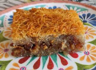 Ένα κομμάτι χρυσαφένιο, σιροπιασμένο κανταΐφι, πασπαλισμένο με τριμμένο καρύδι και κανέλα.