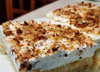 Κοντινό πλάνο σε ένα κομμάτι Εκμέκ Κανταΐφι, που αναδεικνύει τις στρώσεις από τραγανό κανταΐφι, κρέμα και σαντιγί