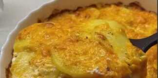 Γκρατέν Πατάτας: Είναι φανταστικό στην γεύση Κοντινή λήψη σε μερίδα γκρατέν πατάτας, αναδεικνύοντας τις στρώσεις πατάτας τυριού και κρέμας