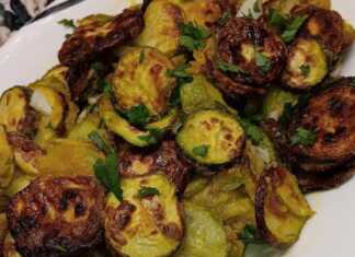 Ψητά κολοκοθάκια σε πιάτο, συνοδευόμενα από δροσερό τζατζίκι