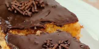 Κομμάτι Μυρμηγκάτο σε πιάτο, με την υγρή υφή του παντεσπάνι και το πλούσιο γλάσο σοκολάτας