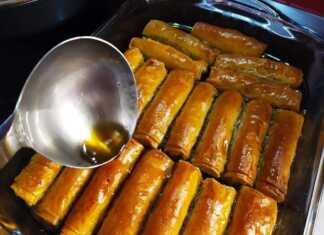 Ταψί γεμάτο με χρυσαφένια, σιροπιαστά Μπακλαβαδάκια με Μέλι