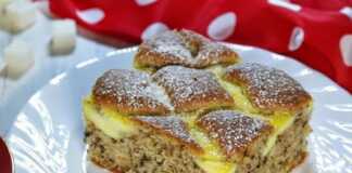 Σπιτική καρυδόπιτα με τυροκρέμα: Η τέλεια συνταγή για το τραπέζι σας! Ένα ολόκληρο κομμάτι σπιτικής καρυδόπιτας με τυροκρέμα, σε μια ξύλινη επιφάνεια