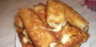 Μια πιατέλα με χρυσαφένιες φλογέρες πατάτας με τυρί, έτοιμες για σερβίρισμα