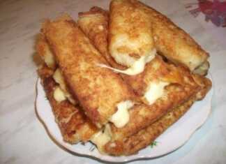 Μια πιατέλα με χρυσαφένιες φλογέρες πατάτας με τυρί, έτοιμες για σερβίρισμα