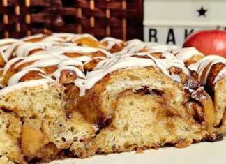 Φοκάτσια Μηλόπιτα με γλάσο, κομμένη σε κομμάτια, που φαίνονται οι υπέροχες στρώσεις της γέμισης.