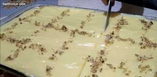 Καρυδόπιτα με την τέλεια Κρέμα Καρυδόπιτα με Κρέμα κομμένη σε κομμάτια, με επικάλυψη κρέμας και καρύδια.