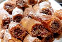 Ρολάκια με Γέμιση Μήλου σε φύλλο κρούστας, πασπαλισμένα με άχνη και κανέλα.