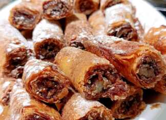 Ρολάκια με Γέμιση Μήλου σε φύλλο κρούστας, πασπαλισμένα με άχνη και κανέλα.