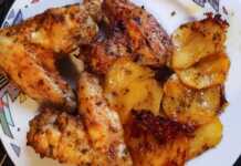 Χρυσαφένιες φτερούγες κοτόπουλου και λεμονάτες πατάτες ψημένες στο φούρνο, σερβιρισμένες σε ταψί