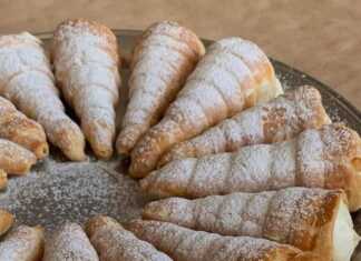 Τραγανά κορνεδάκια σφολιάτας γεμισμένα με πλούσια, λευκή κρέμα και πασπαλισμένα με ζάχαρη άχνη.