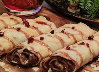 αφράτες κρέπες διπλωμένες σε ρολο, γεμιστές με πραλίνα φουντουκιού και περιχυμένες με χουρμαδόμελο, cranberries και αμύγδαλο φιλέ.