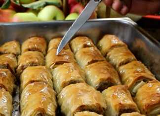 Ρολάκια μπακλαβά γεμισμένα με μήλο και καρύδι, λουσμένα με σιρόπι και ροδισμένα στο φούρνο.