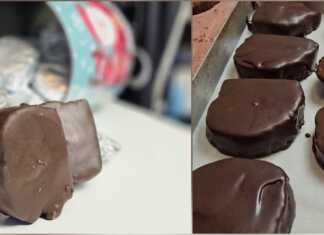 Σπιτικές καριόκες τυλιγμένες σε αλουμινόχαρτο και μερικές κομμένες στη μέση, αποκαλύπτοντας την πλούσια γέμιση από βασιλόπιτα και ξηρούς καρπούς.